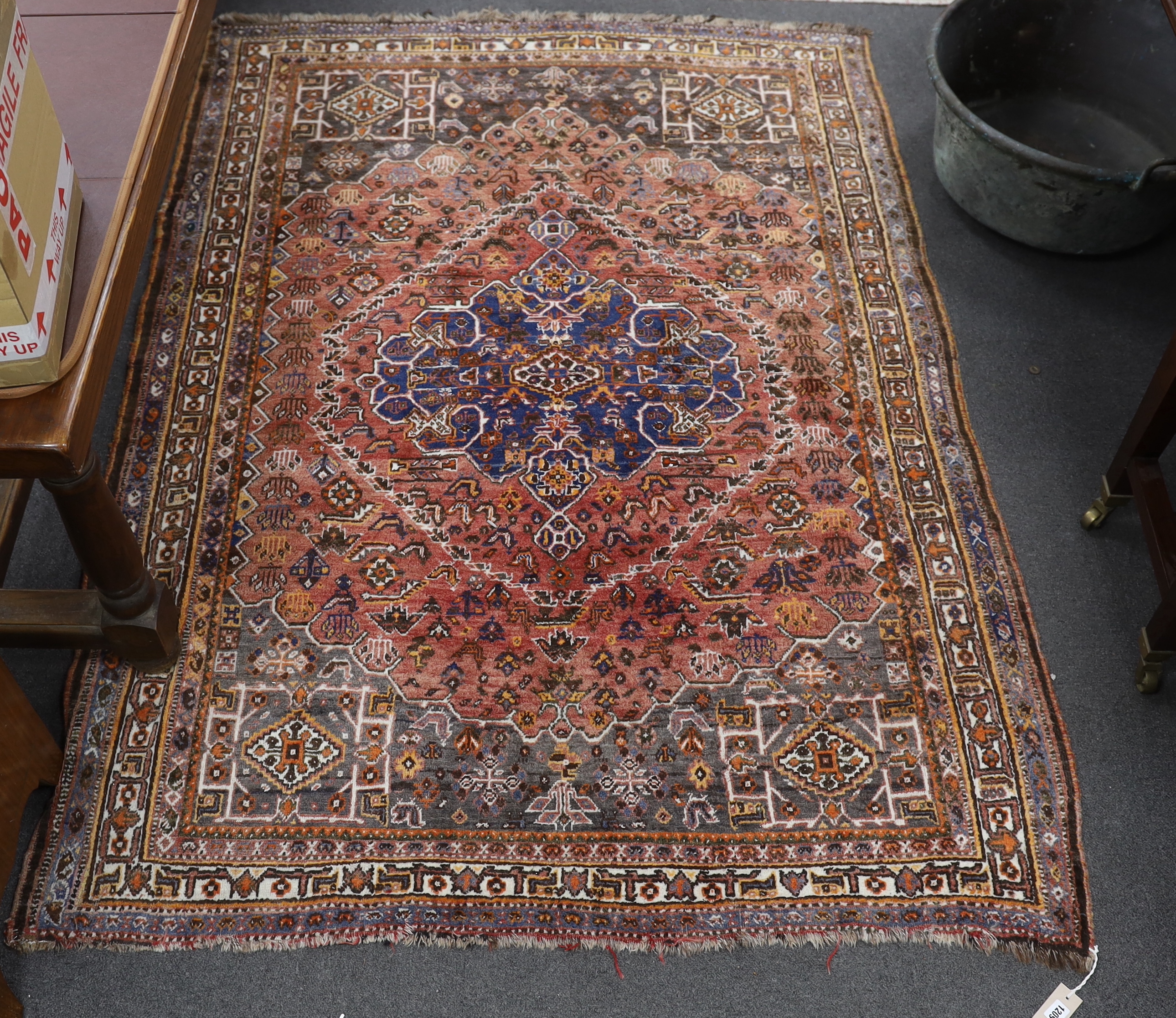 A North West Persian red ground rug, 214 x 156cm